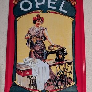 Vintage Opel Tin Sign with Sewing Machine Design